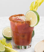 Glass of Classic Caesar garnished with lime
